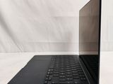 an open laptop computer sitting on top of a white table