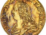 gros plan d'une pièce d'or sur laquelle figure une femme