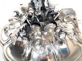 a silver platter with a decorative design on it