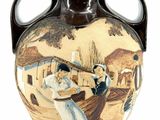 a vase with a picture of a woman and a man on it
