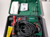 a green box with tools in it on a table