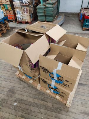 several cardboard boxes are stacked on top of each other on the floor