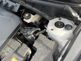 the engine compartment of a car with the hood open