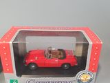 toy car in a box with a dog in the driver ' s seat