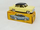 a yellow toy car sitting on top of a yellow box