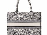 a black and white bag with a pattern on it