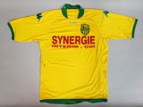 a yellow and green soccer jersey with a green collar