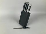 a knife and a knife block with a knife on it