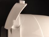 a toilet paper dispenser that is on the wall