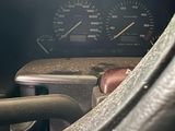 a close up of a car dashboard with a speedometer and gauges