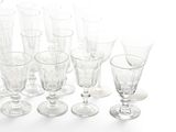 a lot of empty wine glasses sitting on a table