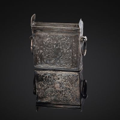 an old silver metal box with a handle and handles