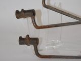 two old tools that are sitting on a white surface