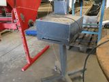 a machine that is sitting on a table in a garage