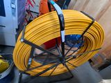 a yellow hose that is sitting on top of a table