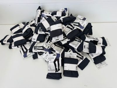 a pile of black and white striped socks on a table