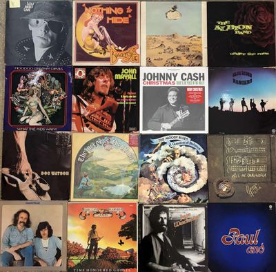 many different albums on the wall of this room