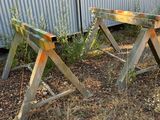 two wooden benches that are sitting in the grass
