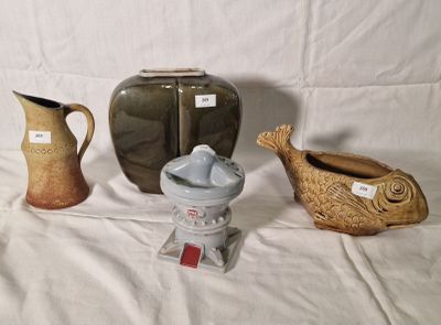 three vases sitting on a table with a white background