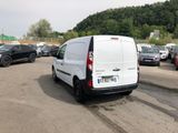 a white van that is parked in a parking lot