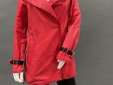 mannequin dressed in a red coat and black leggings