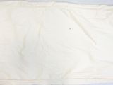 a white blanket on a bed with a white pillow