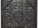un gros plan d'une plaque métallique sur laquelle figure un blason