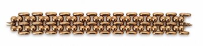 a close up of a row of brass beads on a white background