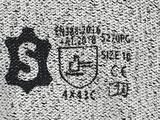 a black and white photo of a logo on a wall