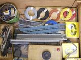 a cardboard box filled with assorted electronics and wires