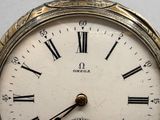 a close up of a clock with roman numerals on it