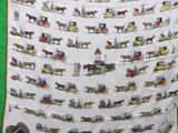 a quilt with a horse drawn carriage pattern on it