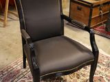 a chair that is sitting on a rug in a room