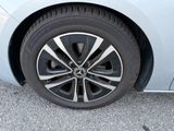 a close up of a car ' s tire on the road