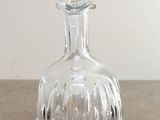 a clear glass decanter sitting on a table