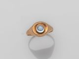 an image of a gold ring with a blue topaz stone