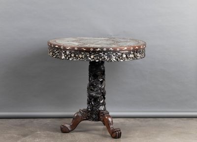 a small table with a marble top on a wooden stand