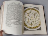 someone is holding a book open to a picture of a pie