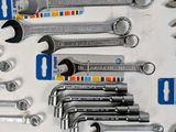 many wrenches that are sitting on a table