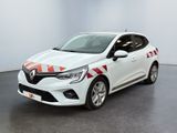 une voiture blanche ornée d'une bande rouge et blanche