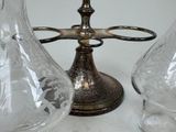 three glass vases sitting next to each other on a table