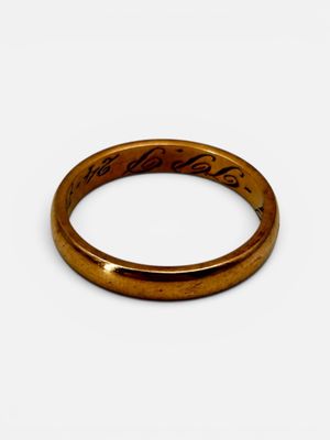 a close up of a ring on a white surface with a white background