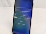 the back of a phone with a display on it sitting on a table