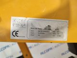 a label on the back of a yellow machine