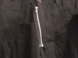 a close up of a pair of black pants with a zipper on the side