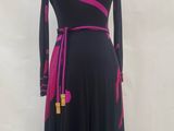 the dress is black and pink with pink flowers on it