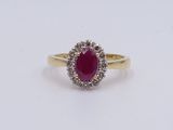an oval ruby and diamond ring