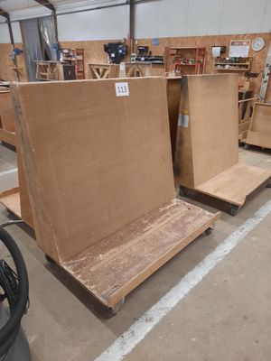 many pieces of furniture that are being assembled in a warehouse