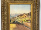 un tableau représentant un paysage avec des collines et des arbres, dans un cadre doré
