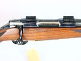 the rifle is sitting on the table ready to be used